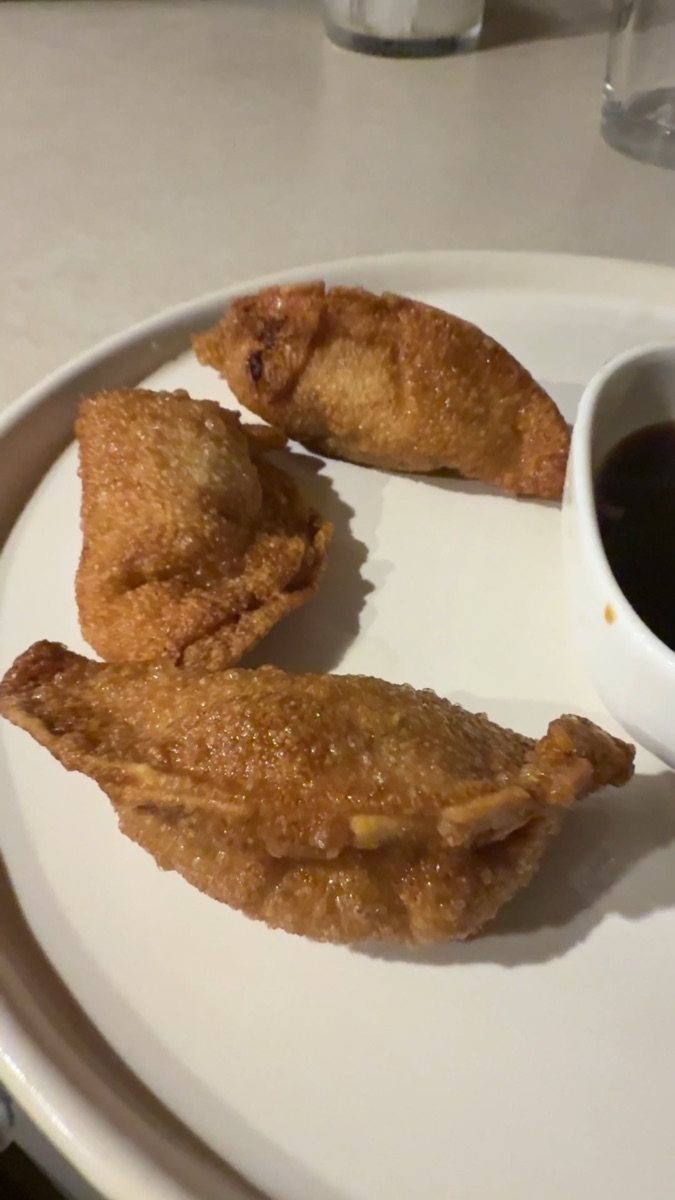 Dumplings from our kitchen served on a plate.